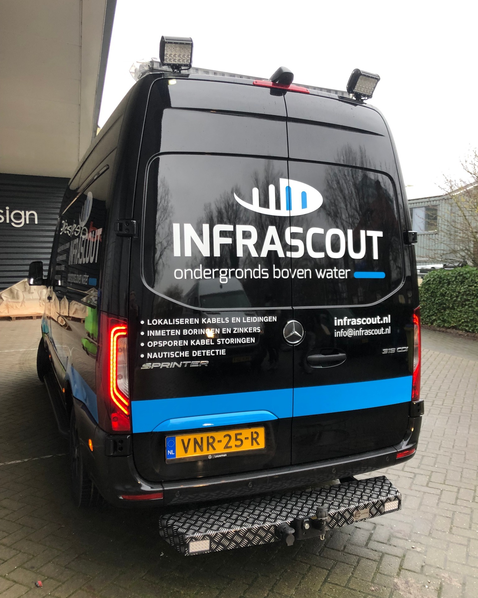 Belettering bus achterkant